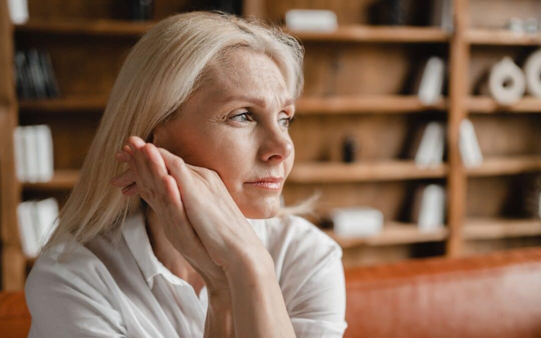 middle-aged mature woman relaxing on the couch sofa