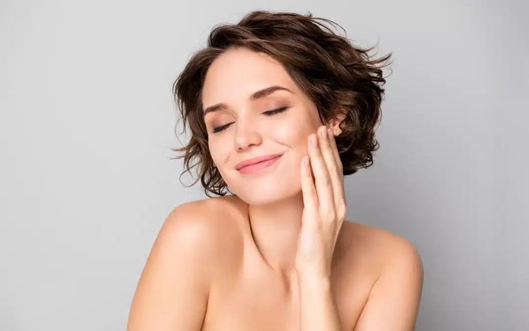 A person showcasing a slender and refined lower face, representing the aesthetic goal of jaw slimming treatments.