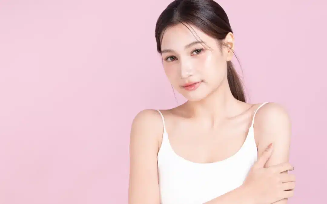 Closeup young asian beautiful woman hand touching arm