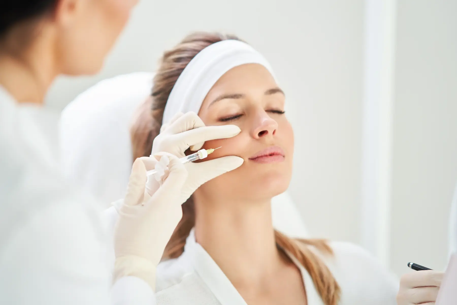 Botox injection being administered to a patient forehead at San Diego Skin in San Diego